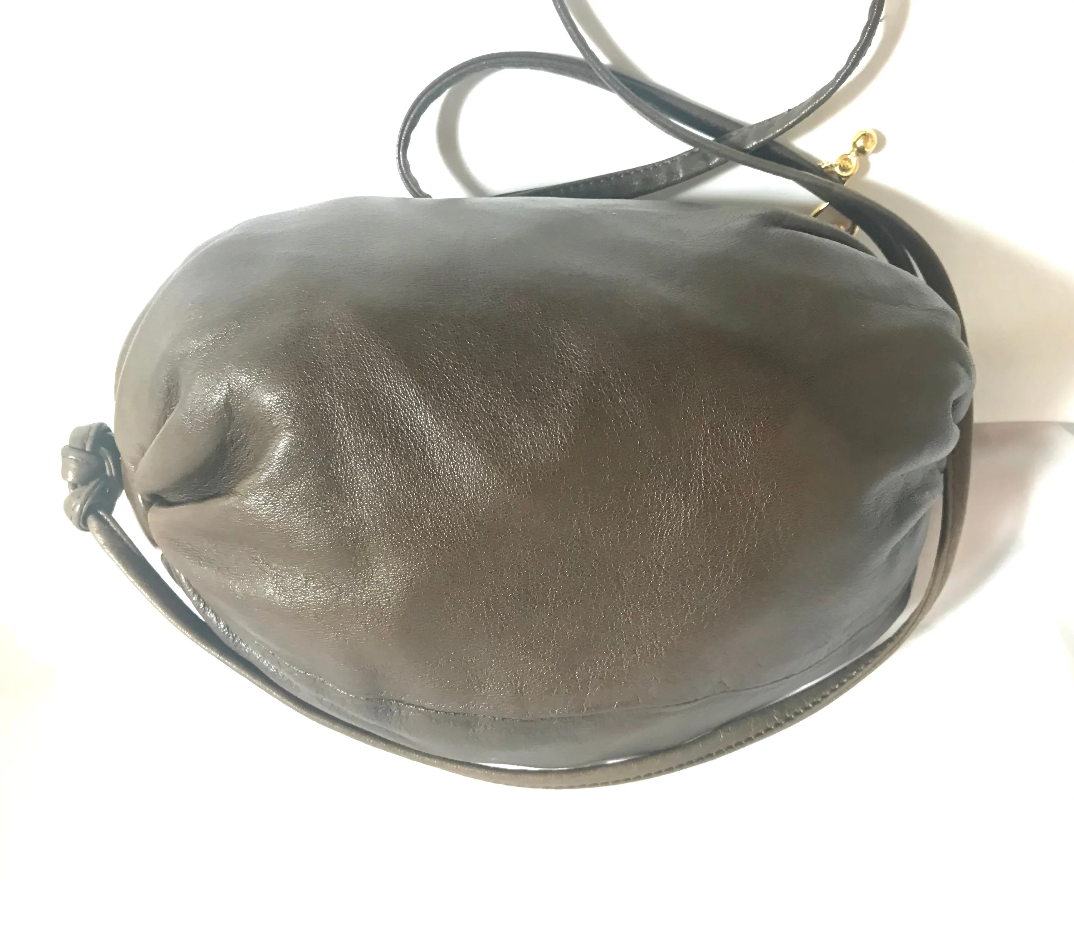 Vintage Moschino soft brown leather drum shape shoulder bag with iconic Question marks. Moschino by Redwall. Made in Italy. 060724r1 Moschino by Redwall. Made in Italy.