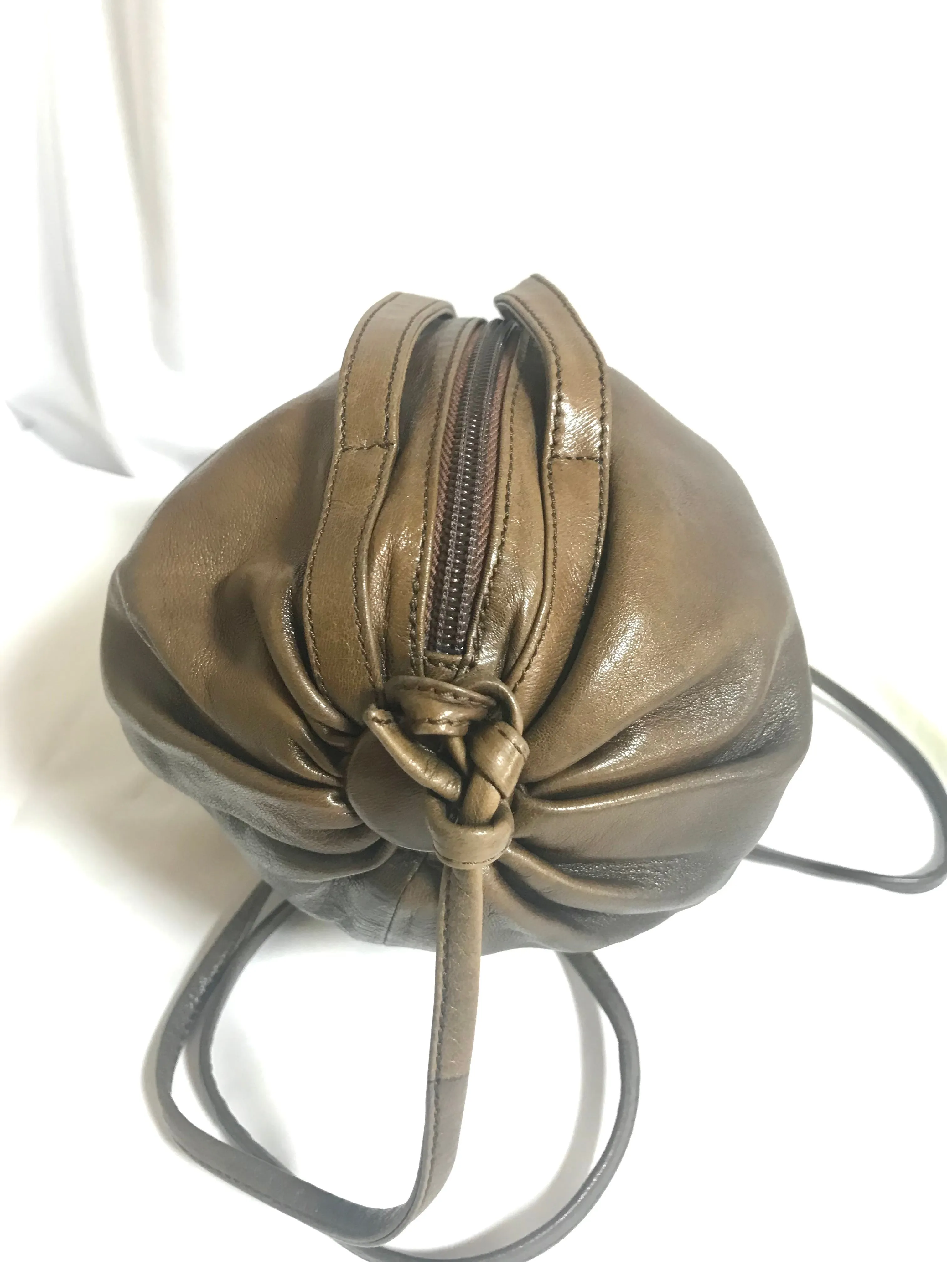 Vintage Moschino soft brown leather drum shape shoulder bag with iconic Question marks. Moschino by Redwall. Made in Italy. 060724r1 Moschino by Redwall. Made in Italy.